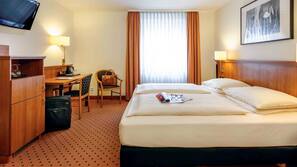 Pillowtop beds, free minibar items, in-room safe, desk