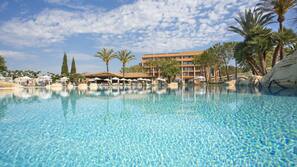 Indoor pool, outdoor pool, pool umbrellas, pool loungers