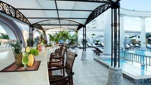 2 outdoor pools, open 7:00 AM to 7:00 PM, pool umbrellas, pool loungers