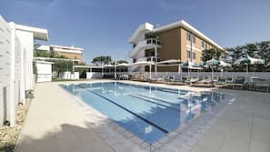 Outdoor pool, open 8 AM to 7 PM, pool umbrellas, sun loungers
