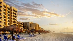 On the beach, beach towels, beach volleyball, beach bar