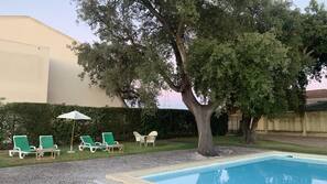 Seasonal outdoor pool, pool loungers