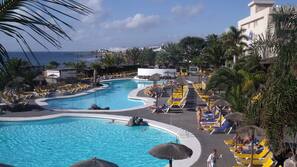 2 outdoor pools, open 10:00 AM to 6:00 PM, pool umbrellas, pool loungers
