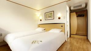 Premium bedding, desk, iron/ironing board, free cribs/infant beds