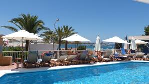 Outdoor pool, pool umbrellas, pool loungers