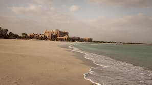 Private beach, beach umbrellas, beach towels, scuba diving