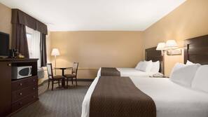 Premium bedding, desk, laptop workspace, blackout drapes
