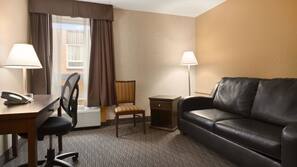 Premium bedding, desk, laptop workspace, blackout drapes