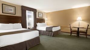 Premium bedding, desk, laptop workspace, blackout drapes