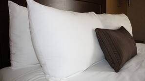 Premium bedding, desk, laptop workspace, blackout drapes