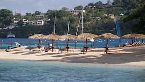 Private beach, white sand, sun-loungers, beach umbrellas