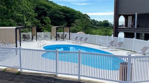 Seasonal outdoor pool, pool loungers