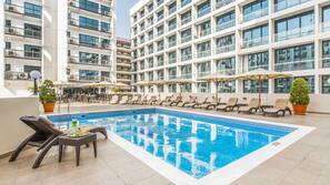 Outdoor pool, pool umbrellas, pool loungers