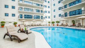 Outdoor pool, pool umbrellas, pool loungers