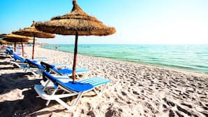 Private beach, white sand, sun-loungers, beach umbrellas