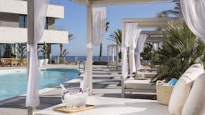 Seasonal outdoor pool, pool umbrellas, pool loungers