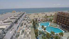 Outdoor pool, open 10 AM to 7 PM, pool umbrellas, sun loungers