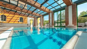 Indoor pool, open 9:00 AM to 9:00 PM, pool loungers