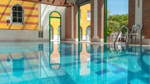 Indoor pool, open 9:00 AM to 9:00 PM, pool loungers