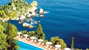 Seasonal outdoor pool, pool umbrellas, pool loungers