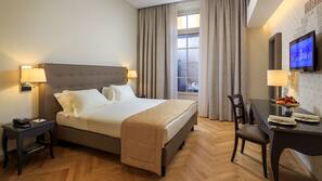 Luxe beddengoed, een minibar, een kluis op de kamer, een laptopwerkplek