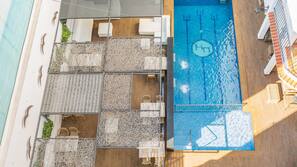 2 outdoor pools, a waterfall pool, pool umbrellas, pool loungers