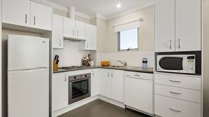Full-size fridge, microwave, stovetop, coffee/tea maker
