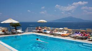 Outdoor pool, pool umbrellas, pool loungers