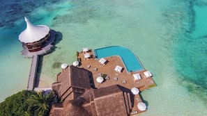 Outdoor pool, open 11:00 AM to 6:00 PM, pool umbrellas, pool loungers