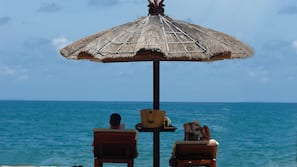 On the beach, white sand, free beach cabanas, sun-loungers