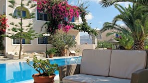 Seasonal outdoor pool, pool umbrellas, pool loungers