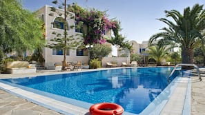 Seasonal outdoor pool, pool umbrellas, pool loungers