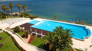 Indoor pool, outdoor pool, open 7 AM to 8 PM, pool umbrellas
