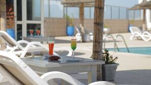 Seasonal outdoor pool, pool umbrellas, sun loungers