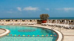 Outdoor pool, open 8:00 AM to 8:00 PM, pool umbrellas, sun loungers