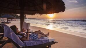 On the beach, sun loungers, beach umbrellas, beach towels