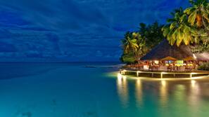 On the beach, white sand, free beach cabanas, sun loungers