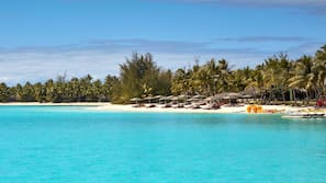 Private beach, white sand, sun-loungers, beach umbrellas