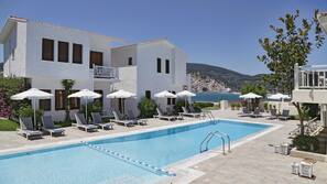 Seasonal outdoor pool, pool umbrellas, pool loungers