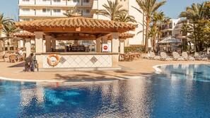 Indoor pool, outdoor pool, pool umbrellas, pool loungers