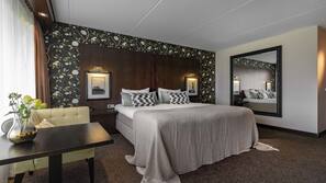 Luxe beddengoed, een minibar, een kluis op de kamer, een bureau