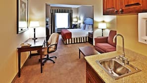 Premium bedding, desk, laptop workspace, blackout drapes