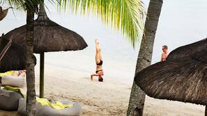 On the beach, sun-loungers, beach umbrellas, beach towels
