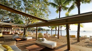 On the beach, sun-loungers, beach umbrellas, beach towels