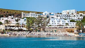 On the beach, sun-loungers, beach umbrellas, beach towels