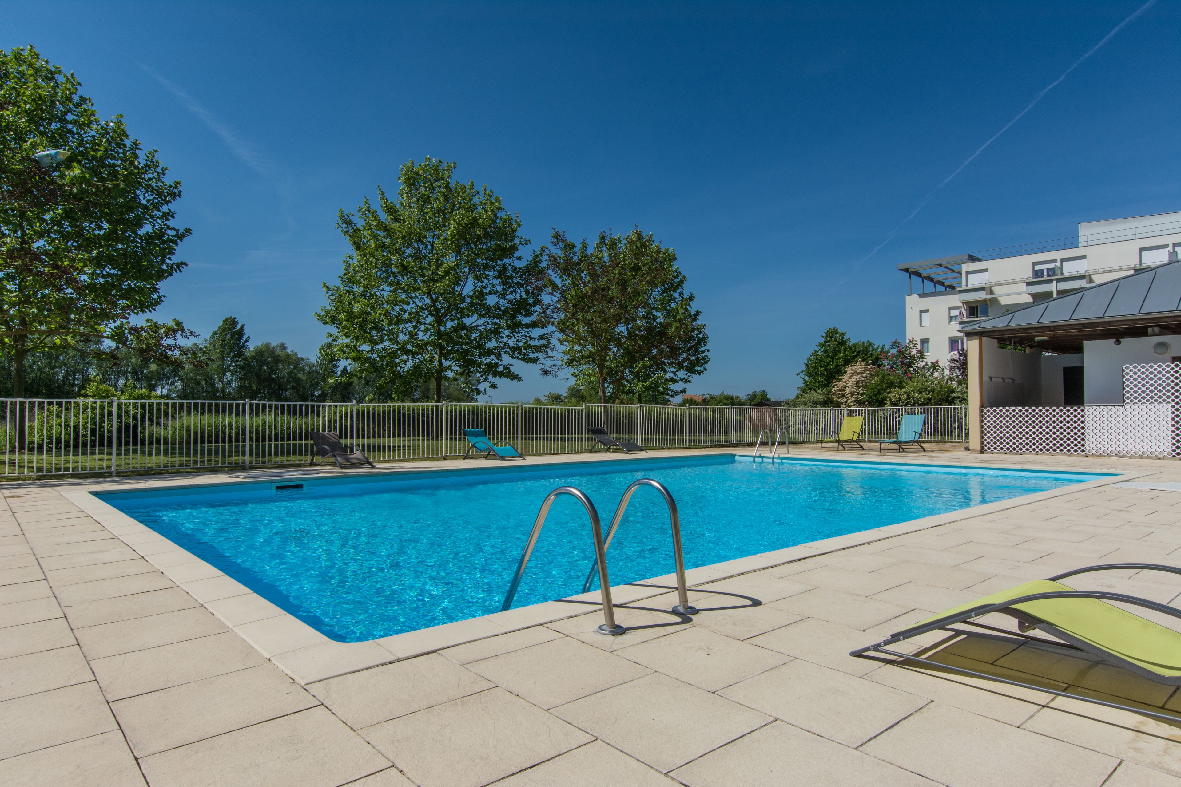 Seasonal outdoor pool, open 10:00 AM to 9:00 PM, pool loungers