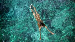 On the beach, sun-loungers, beach umbrellas, rowing