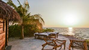 Private beach, white sand, sun loungers, beach umbrellas