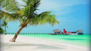 White sand, beach towels, beach massages, water skiing