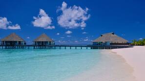 Private beach, white sand, sun loungers, beach umbrellas